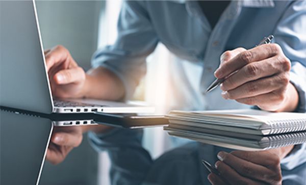 close up of someone working at computer